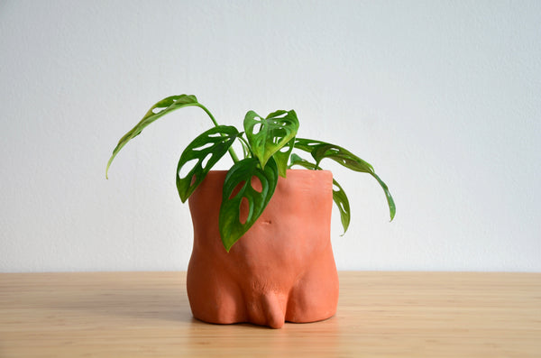 Group Partner terracotta boy planters in Singapore - handmade pot