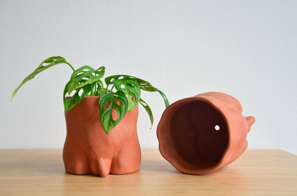 Group Partner terracotta boy planters in Singapore - handmade pot